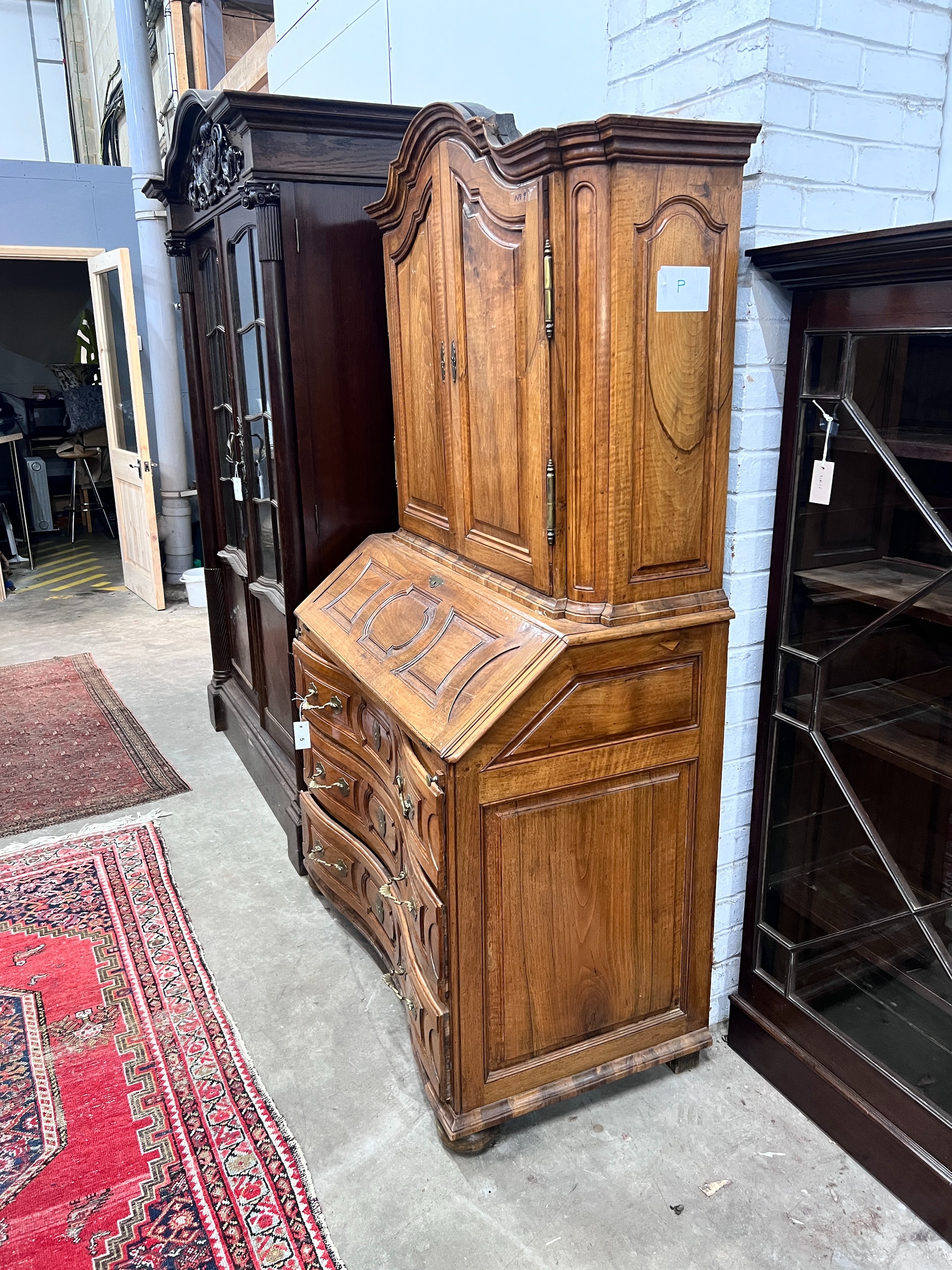 A 19th century German walnut bureau cabinet, width 105cm, depth 57cm, height 188cm, *Please note the sale commences at 9am.